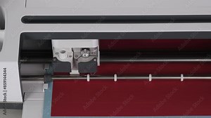 Front view on Smart Cutting machine for home using. Plotter digital flatbed cut out details on red cardboard on blue mat. DIY manual paper craft, making gift for family. Creative Hand crafting project