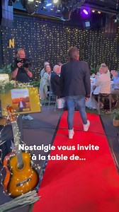 1.1M views · 4.2K reactions | Une veste iconique, une démarche détendue et un sourire perceptible même de dos  Vous l'avez reconnu? ⭐ Ajoutez à ça une table joliment dressée et des convives aux yeux qui brillent... et voilà le programme d'un samedi soir hors du commun 朗 Nostalgie vous invite à la table de cet artiste exceptionnel le 30 août ✨ | Nostalgie Belgique | Facebook