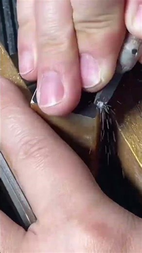 Carving straight line patterns on brown stone seal carefully