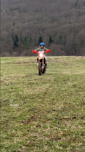 teaching young boy to ride dirt bike