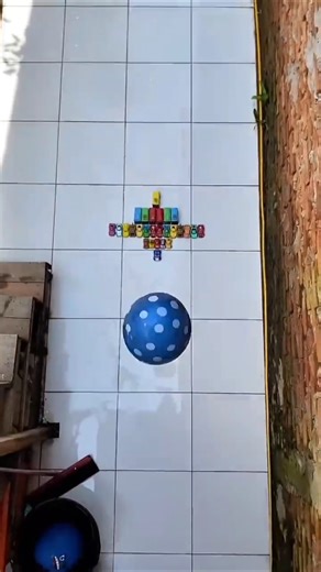 Experiment: Dropping colorful emoji water balloons from a height