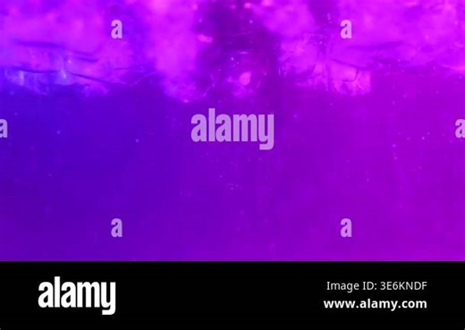 Ice cubes underwater with purple and blue neon light, oxygen bubbles, and dark background. Concept of nightlife, beverage, cooling, bar, advertising, technology, and modern design Stock Video Footage - Alamy