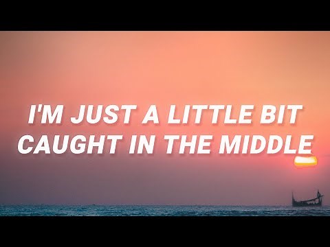 Lenka - I'm just a little bit caught in the middle (The Show) (Lyrics)