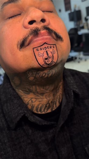 Tattoos By Nelly on Instagram: "Another Raiders tattoo 🏴‍☠️ WHOS NEXT📢 this was such a fun one thank you for the trust 🙏🏽 I would be hella down to do more chin tattoos 🫡 #sacramentotattooartist #raiders #raidertattoo #raidernation #raiderstattoo #raiderfans #sacramentotattoos #blackandgreytattoo #elkgrovetattoos #bayareatattooartist #sacramento #209tattoos #916tattoos"