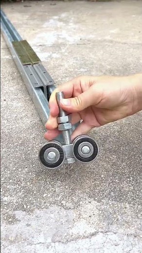 Sliding door track and pulley for industrial factory gates Hanging track and pulley, sliding door.