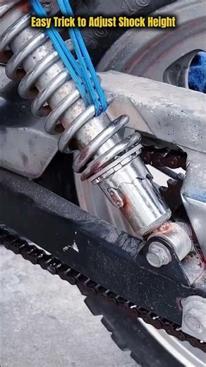 Motorcycle Shock Height Adjustment by Skilled Mechanic: Spring Compression Preload Setting Process