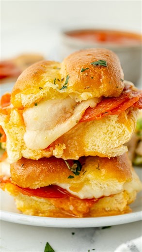 Because after all that trick-or-treating, you need something cheesy and satisfying 🍕✨ These pizza sliders are the ultimate quick snack — melty, buttery, and ready in minutes. Perfect for refueling between candy raids! 👻🎃 Comment “PIZZA” to get the recipe sent to your DMs! INGREDIENTS 12 slider rolls , cut in half 1/2 cup marinara sauce , more for dipping 1 cup low moisture mozzarella cheese , shredded 1/2 cup sliced pepperoni , about 24 thin slices 4 tablespoons unsalted butter , melted 1 tea