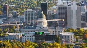 Utah State Capitol and Salt Lake City skyline with panning motion. Salt Lake City, is the capital and most populous city of the U.S. state of Utah