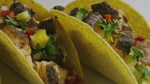 Close shot of a couple of tacos on a plate - Free Stock Video