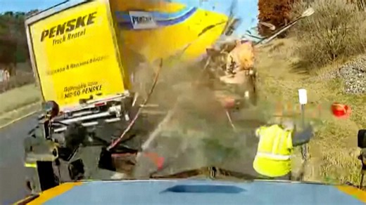 Watch: Moment road worker dodges high-speed truck crash