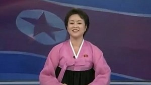 Enthusiastic North Korean news reader reports rocket launch