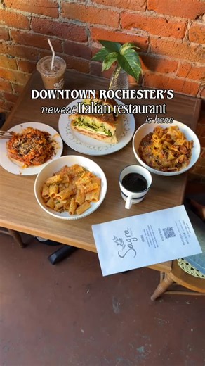 A little slice of Italy just opened in downtown Rochester! 🍝 Say ciao to @sagra_italia, brought to life by the owners of @tapas177 and @event.180, now open on St Paul St and bringing authentic Italian flavors to the heart of our city. From homemade focaccia pizzas and sandwiches to fresh pasta, coffee, salads and more, the menu features dishes with personal roots— sandwiches named after the region of Italy their family is from and menu items that use family recipes, too. Whether you’re swinging