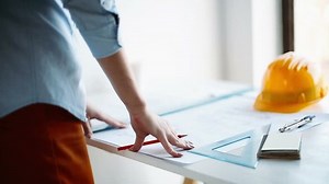 Architect working on project. Construction engineering concept