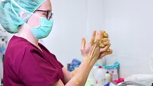 Surgeon washing her hands before beginning the surgery. High quality 4k footage