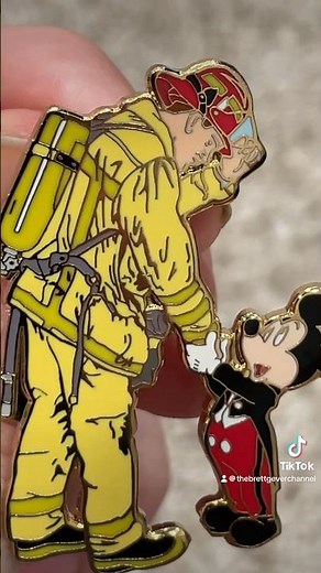 Mickey Mouse shaking hands with the firefighter pin #firefighter #mickeymouse #disney #disneypins
