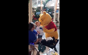Watch: Pooh Bear at Disney World doting over a special needs child