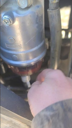 How to drain fuel water separator bowl in diesels! #construction #excavator #dozerking #cold #life