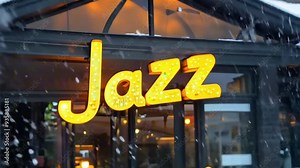 Jazz sign on a window of a jazz bar. Large snowflakes falling outside. Cozy interior visible through the window