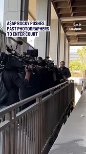 Rapper A$AP Rocky pushed past several photographers on Friday as he entered a Los Angeles court for opening statements in his assault trial. Rocky, whose legal name is Rakim Mayers, is accused of shooting a former friend near a Hollywood hotel in 2021. | AP