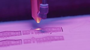 Close-up of laser printer engraving patterns. Media. Dot laser engraves patterns in robotic printer. Laser printers for fine engraving on any material