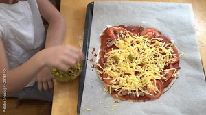 The girl cooking healthy gluten-free pizza with beef. Gluten-free cooking class. Cooking together at home with a parent. Recipe step by step