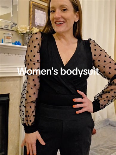 Long sleeve black bodysuit with sheer mesh dot sleeves, stretch fabric, and snap closure. A versatile top for casual or dressier outfits. #womensbodysuit #sheermeshtop #longsleevebodysuit #vnecktop #blackfashiontop @OHYEAH