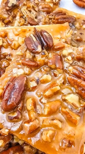 Pecan Pie Bark Ingredients: 1 sleeve graham crackers (about 9–10 full sheets) 1 cup (2 sticks) unsalted butter 1 cup brown sugar, packed 1 teaspoon vanilla extract 1 ½ cups chopped pecans Pinch of salt Instructions: Preheat the oven to 350°F (175°C). Line a rimmed baking sheet with parchment paper or foil. Arrange the graham crackers in a single layer over the prepared baking sheet, breaking them as needed to fit. In a medium saucepan, melt the butter over medium heat. Stir in the brown sugar an