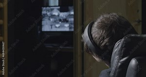 Security guard falls a sleep in front of camera screen and wakes up