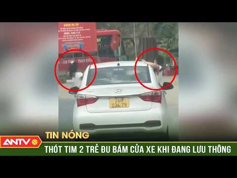 Driver fined for allowing two children to stick their heads out and cling to the car door while i...