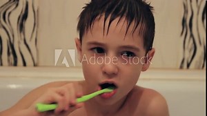 Young boy brushing his teeth
