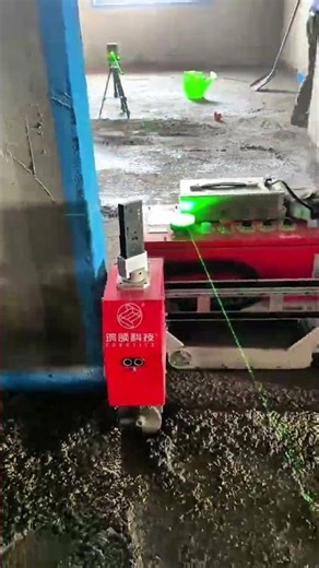Laser leveling projects green line on wet concrete