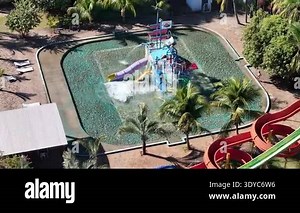 Lagoa Santa, Goias, Brazil - 05 05 2024. drone orbit over a children's water playground with colorful slides, fountains and a tipping bucket dumping water Stock Video Footage - Alamy
