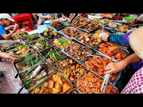 A street food stall with dozens of tempting dishes on the sidewalk in Saigon - Vi Na TV