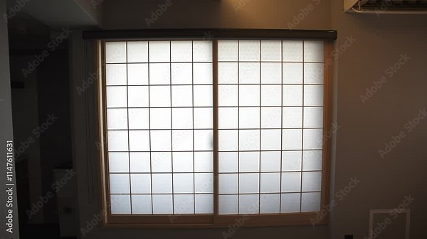 A close-up of a traditional Japanese window in Kyoto, showcasing intricate design and craftsmanship, offering a peaceful view into Japan's rich architectural heritage.