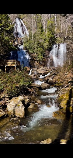 This beautiful waterfall is Anna Ruby Falls in Georgia! Follow TravelWith ThisDuo for More Waterfalls and Hikes! #roadtripusa #roadtrip #travelcouples #travelcouple #adventures #waterfall #waterfalls #water #beautifuldestinations | TravelWith ThisDuo