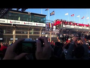 2011 Australian Formula 1 Grand Prix: Podium celebration from the crowd on main straight