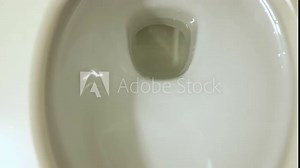 Top view, the toilet flushes water. Water flow in a clean disinfected toilet bowl, toilet. Closeup toilet, Water concept