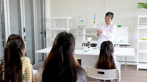 Senior science teacher guides a diverse group of students through experiments, encouraging collaborative learning experience in classroom, elderly instructor pensioner hiring in private school