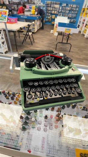 ⌨️ Click. Clack. Create. ✨ Behold Set #21327: Type Writer! A classic piece of history encased in the unique sand green, this set is perfect for collectors and history buffs! There's something for everyone at BAM Rochester! Stop in today! | Bricks & Minifigs Rochester, MN