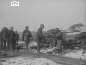 New Zealand gunners are issued Christmas parcels by the Battery Quartermaster Sergeant on the Western Front, 1917. Film: IWM 166 | Imperial War Museum London