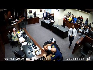 Son of slain woman tries to attack accused killer in court