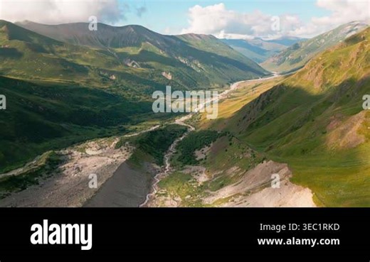 Scenic aerial panorama beautiful Enguri gorge river flows in Caucasus mountains Georgia. Hiking route Ushguli to Shkhara glacier. Winding river alpine slopes green ridges dramatic morning light Stock Video Footage - Alamy