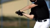 Super Slow Motion shot of a professional baseball batter hitting a...