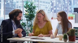 Financial advisor inviting clients to sign formal agreement documents, managing their future investments. Customers writing signature on contract, agreeing to have their assets monitored, camera B