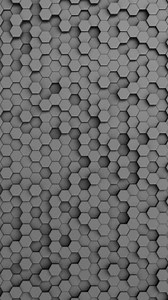 Looping 3D animation of a matte gray hexagonal pattern.
