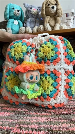 9.8K views · 115 reactions | Livin la vida Retro (Stripe). #GRWM: matching my Labubu edition.  Featured patterns: Crochet Lafroufrou Hat and Dress Pattern, Crochet Bucket of Waffles Hat, Crochet Granny Square Retro Top, Pack a Bunch Backpack, and tiny cameo of the Crochet Cat Couch (bonus internet points if you can spot it!) | Red Heart Yarns | Facebook