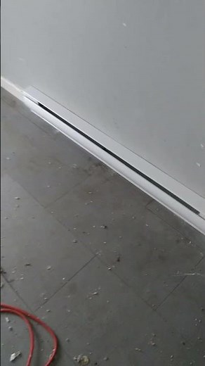 Completed baseboard and thermostat installation.