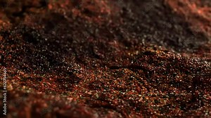 Luxurious flow of particles on a dark background. Quicksand. Whirlwinds stream of sand, grains and small pebbles. Fluid ink particles. Macro, DOF. Sophisticated and high end. 3d vj animation