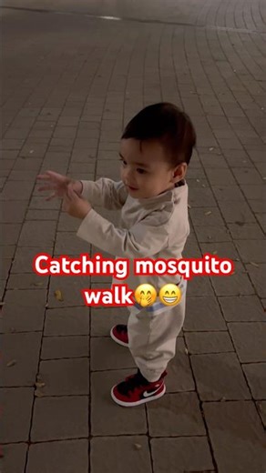 Catching mosquitos while walking 😅 | Happy at toddler stage #shortsfeed #cutebaby