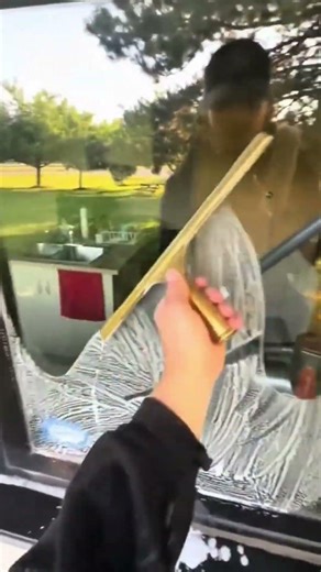 Example of cleaning a window with soap that is applied and becomes wet but ready to be wiped #shorts